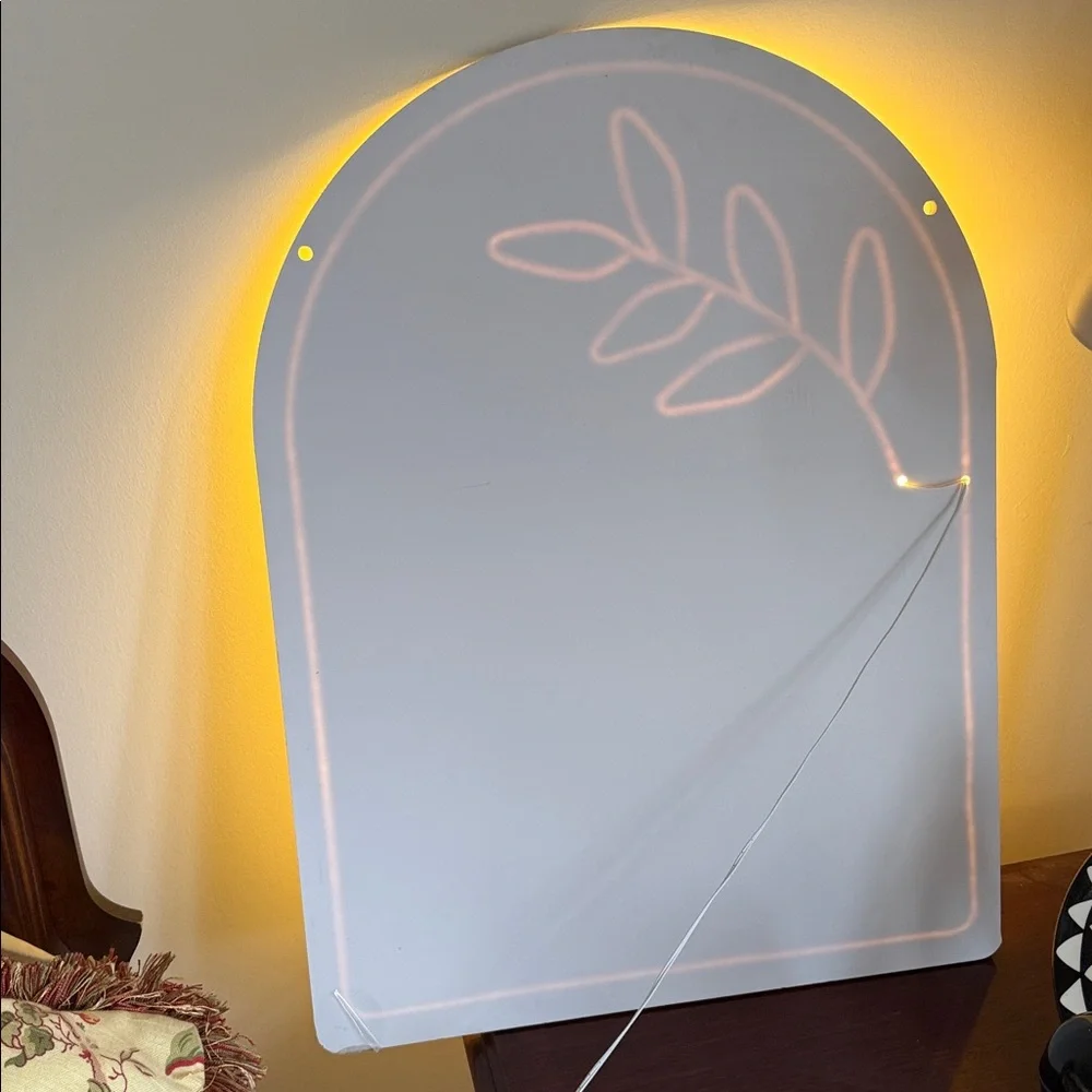 Contemporary White Arch Wall Mirror with Leaf Accent
